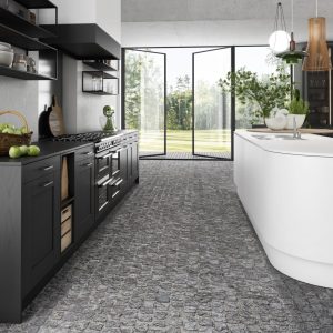 Cuisine noire avec un îlot central ovale blanc